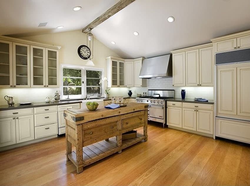 Kitchen with salvaged wood countertop and plank floor