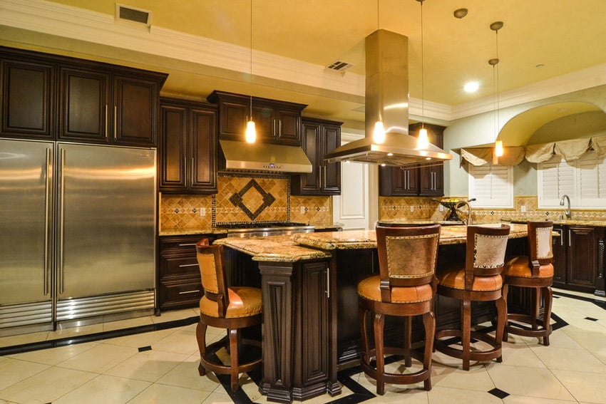 Dark cabinet kitchen with yellow river granite countertops