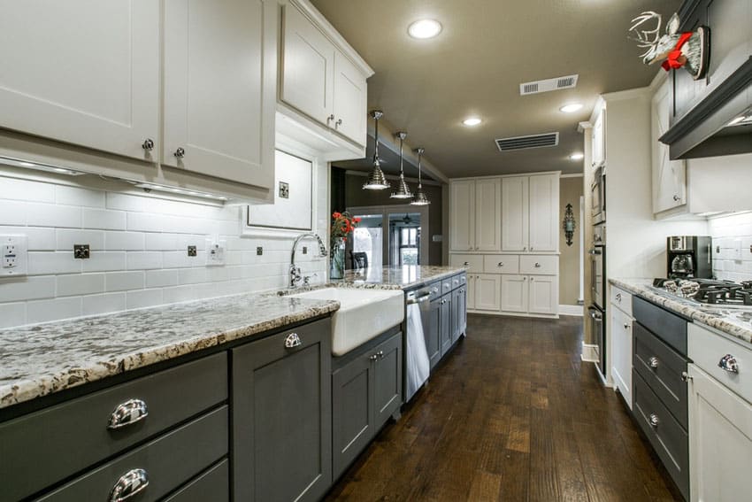 Galley kitchen with flat panel cabinets hardwood floor