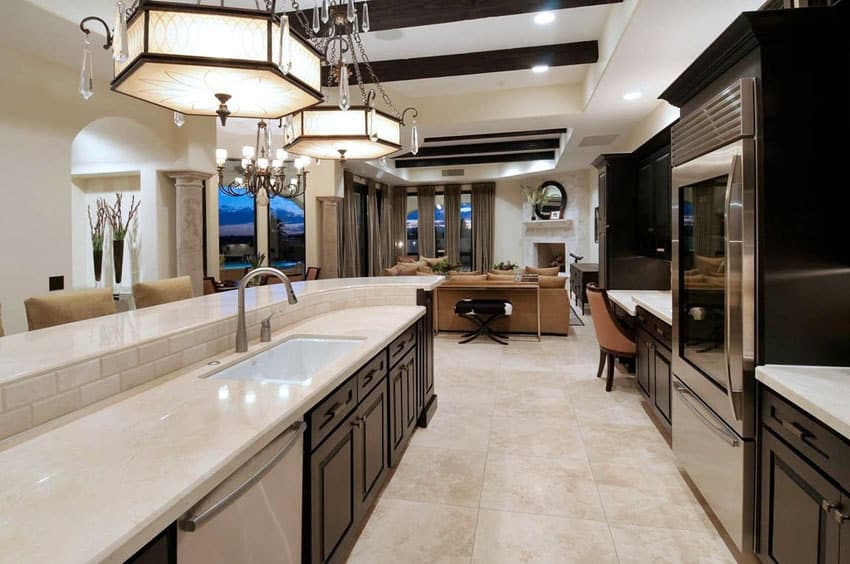 Kitchen with limestone counter dark cabinets