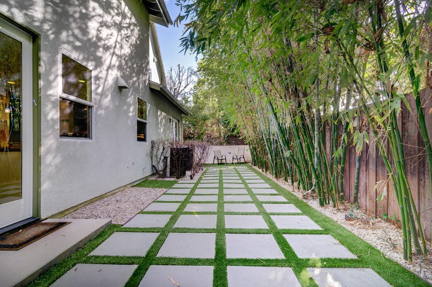 Gray concrete paver step walkway in backyard