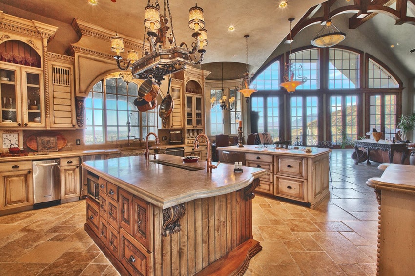 Kitchenw ith high ceiling, arched doors and walnut kitchen island