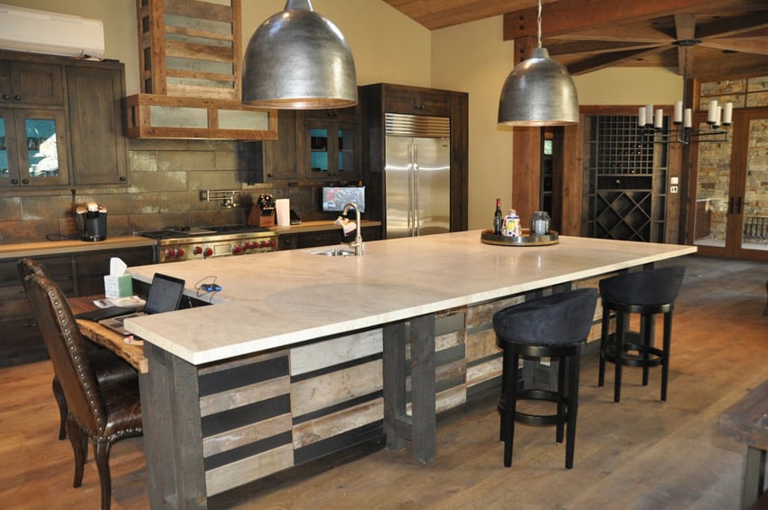 Kitchen with oversized island with seating and quartz countertops