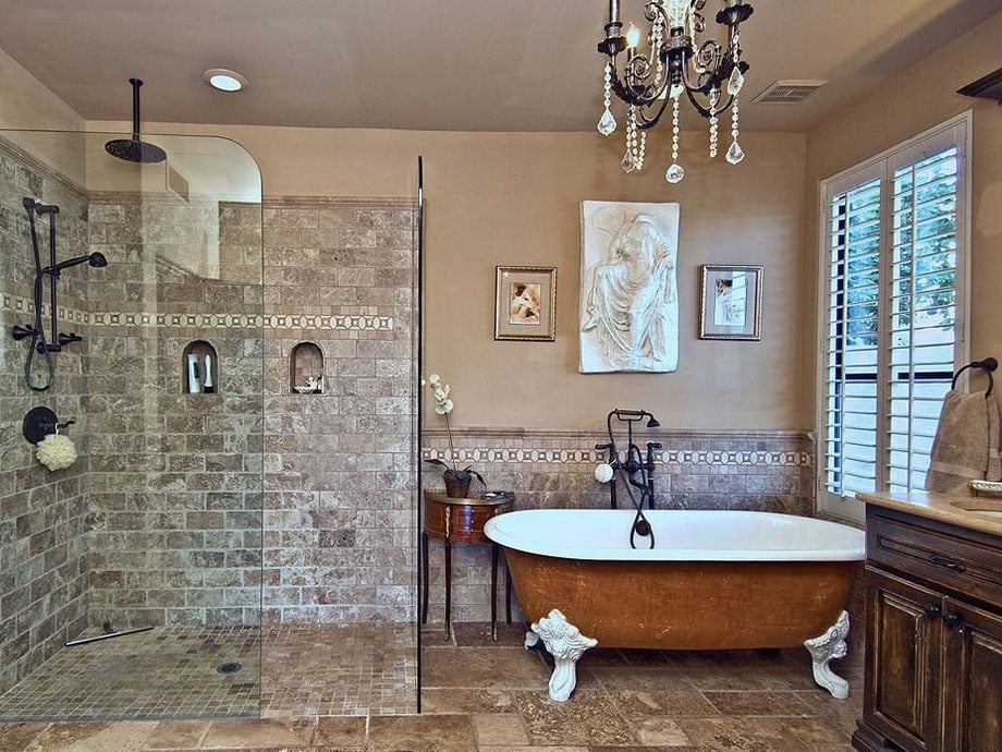 Master bathroom with chandelier and glass shower