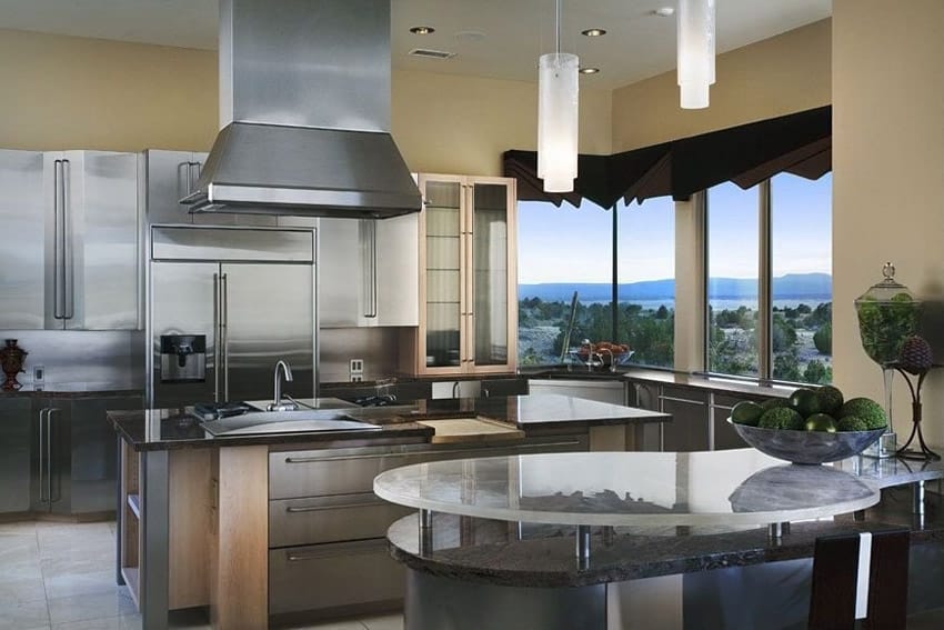 Kitchen with glass topped counter and steel cabinets