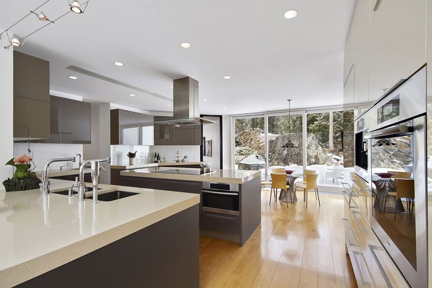 Kitchen with white quartz counter, built-in induction cooktop and high gloss cabinets