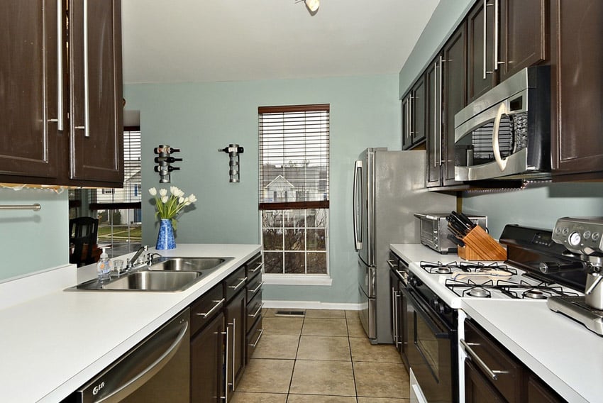 Small galley kitchen with white laminate counters