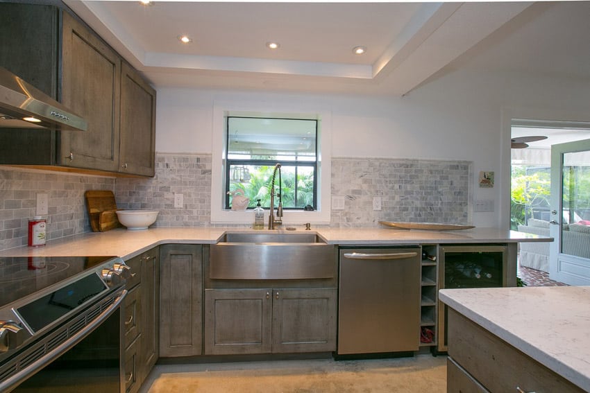 Small kitchen with bianco venatino marble countertops