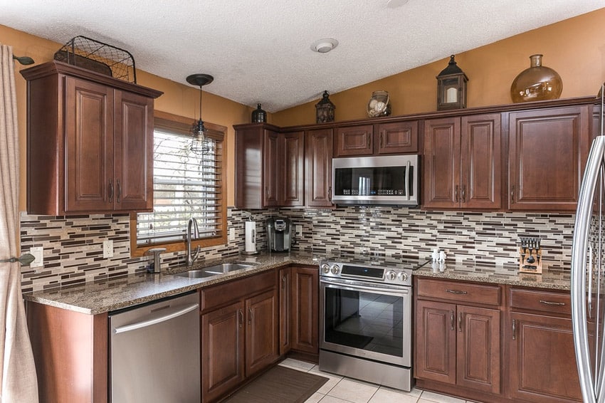 Traditional kitchen in corner l shape limestone floors