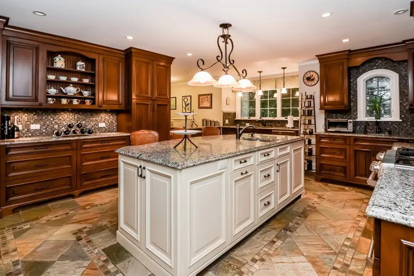 Traditional kitchen with cascade white quartz counters large island