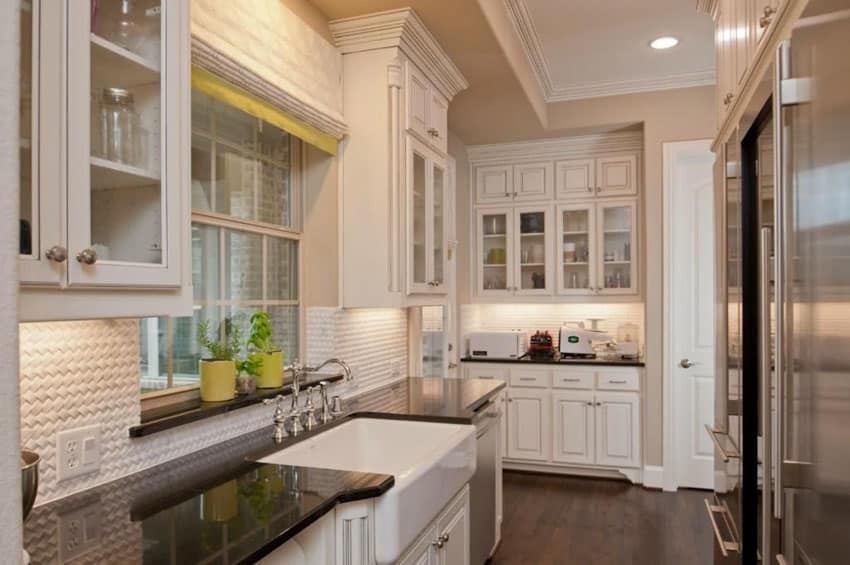 Traditional white galley kitchen with farmhouse sink