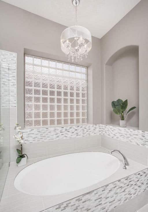 White bathroom with chandelier