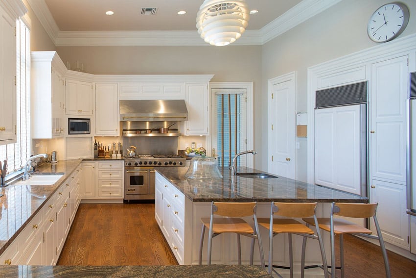 White cabinet kitchen with modern chandelier over island