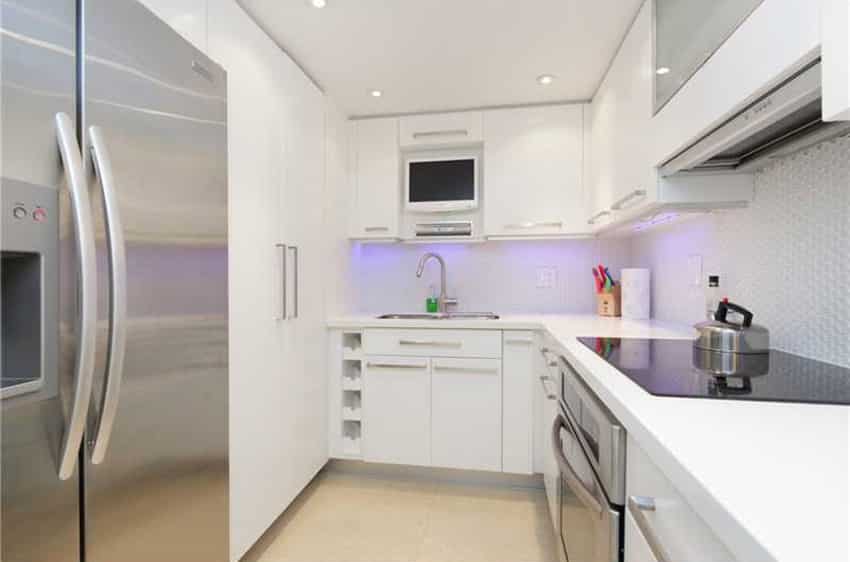 White closed kitchen layout with neon backlight