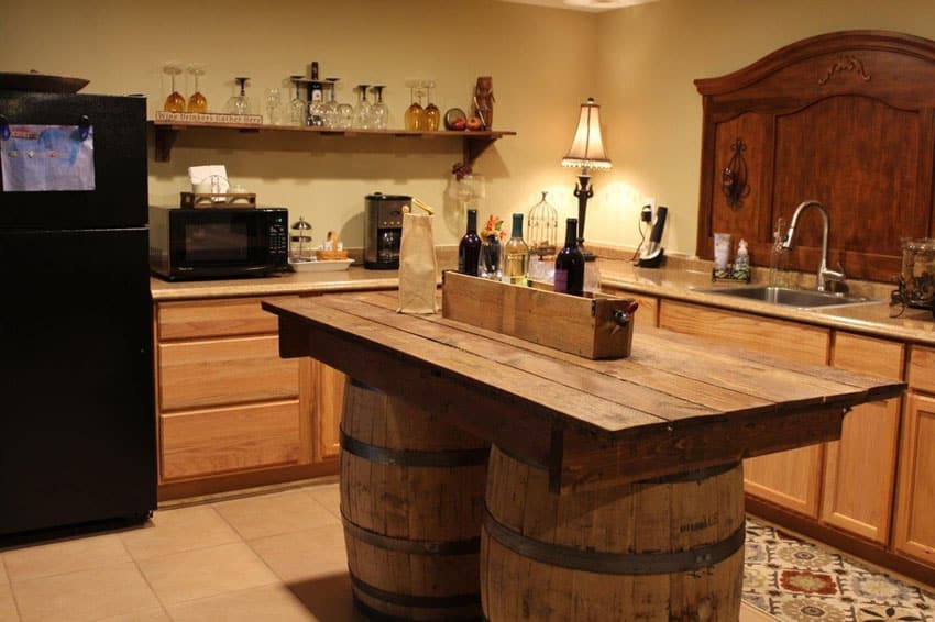 Wine barrel base island and open shelving with wineglasses