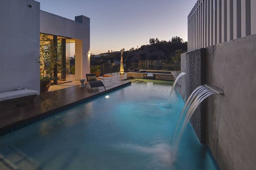 Swimming pool with waterfall water features