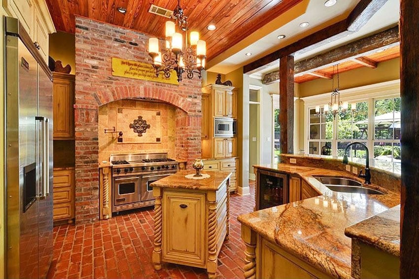 Country kitchen with brick wall brick floors and limestone countertops