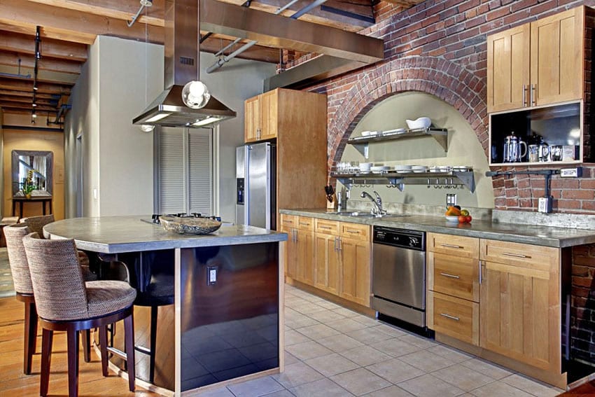 Craftsman kitchen with arched brick wall above countertop