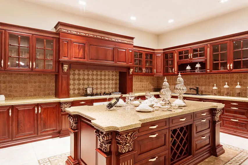Island counters with classical molding elements, rug and diamond pattern backsplash