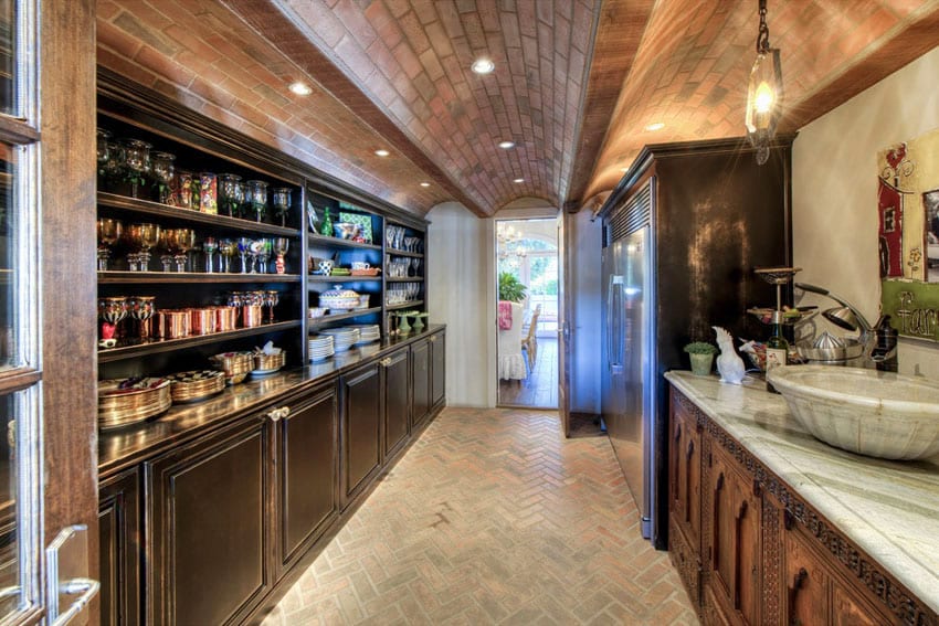 Galley kitchen with brick vaulted ceiling