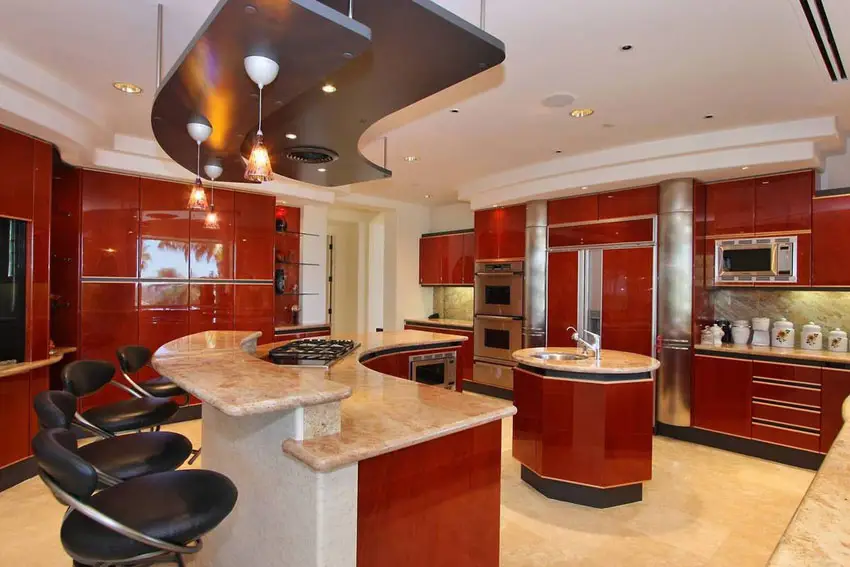 Kitchen with high gloss cherry wood laminates with cream floors
