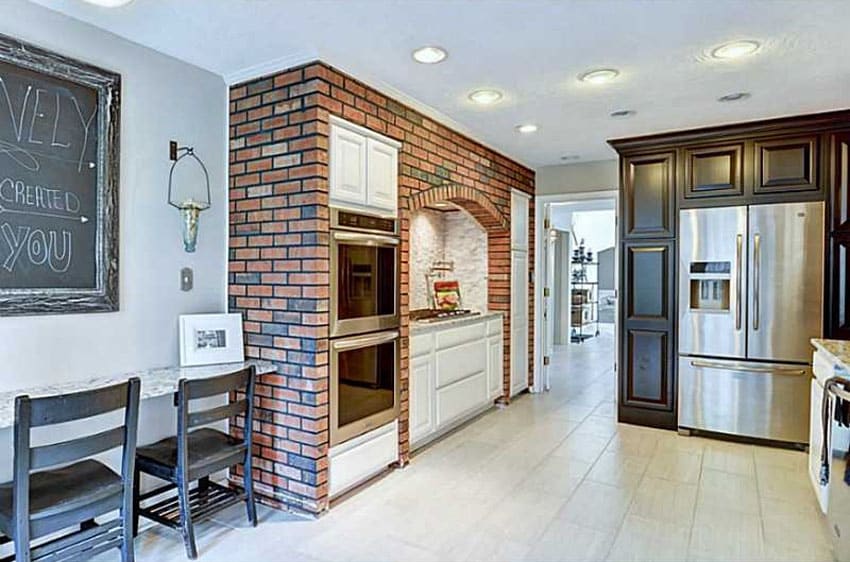 Kitchen with brick facade wall around stove