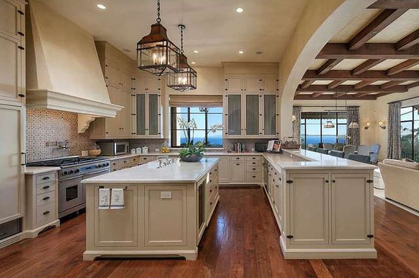 Luxury kitchen with ocean view white cabinets and hardwood floor