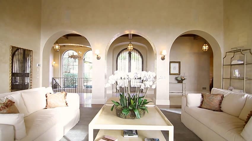 Luxury living room view to foyer entry with arches