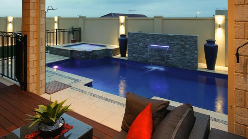 Pool with elevated spa and built-up ledge