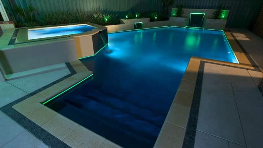 Luxury swimming pool with neon lighting water feature waterfalls
