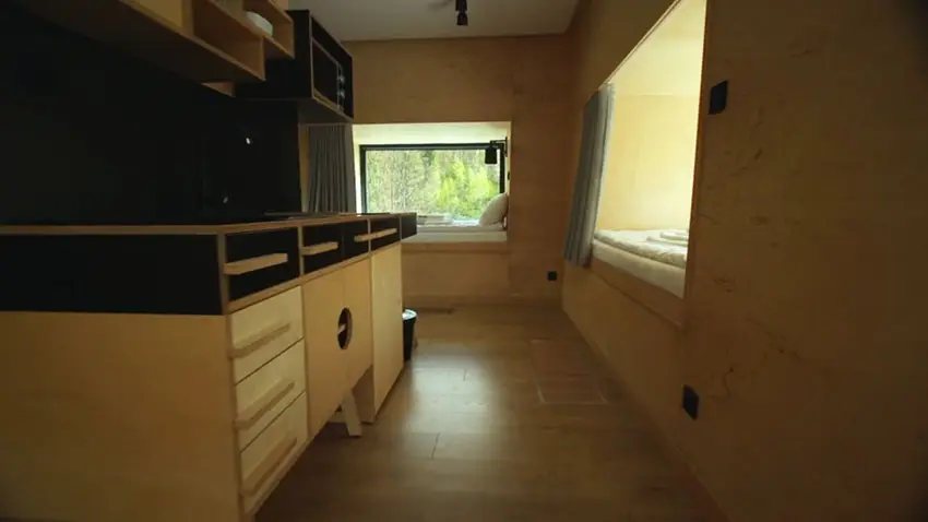 Micro apartment kitchen design with view to sleeping area