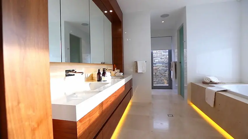Modern bathroom with dual sinks and tub