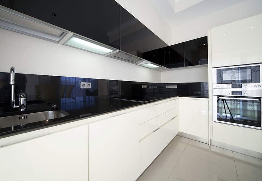 Modern l shape kitchen layout with black and white cabinets