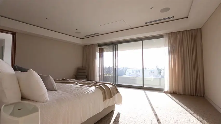 Modern minimalist master bedroom with view