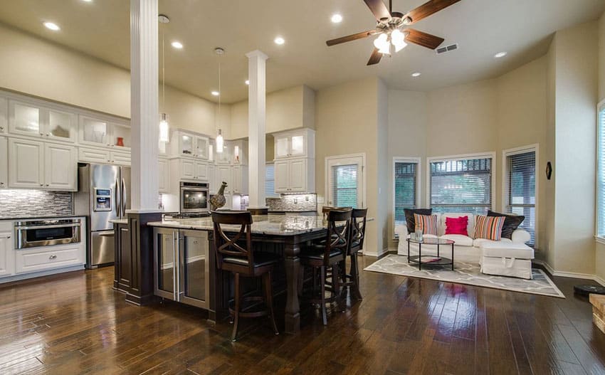 Kitchen with wood pillars and large dining island