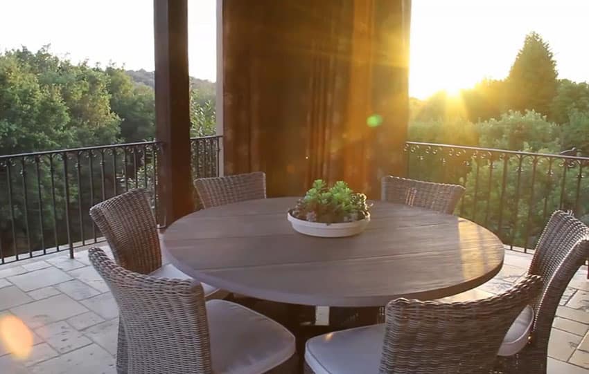 Outdoor dining balcony with harbor view