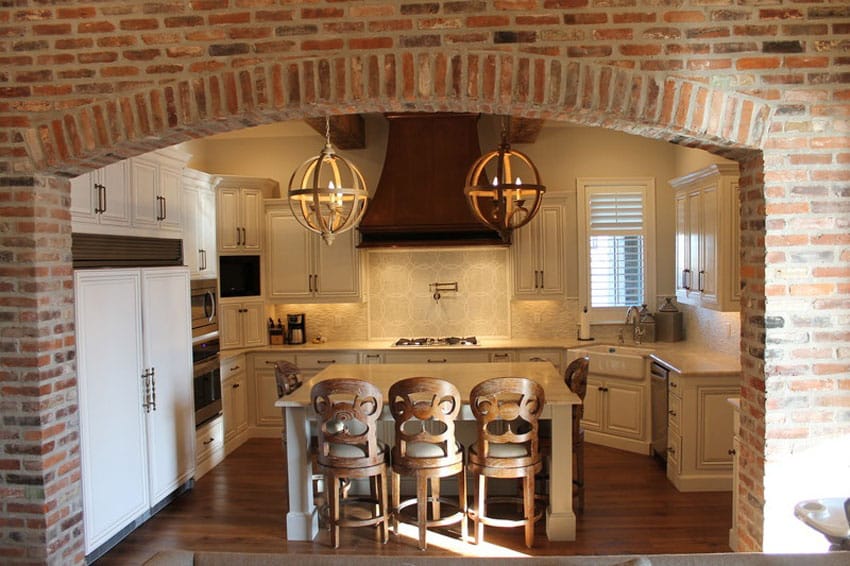 Traditional kitchen with brick archway entry