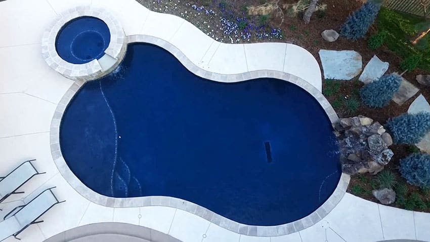 Aerial view of swimming pool with rockfall water feature