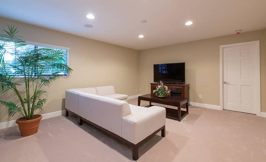 Clean minimalist living room with dark yellow walls