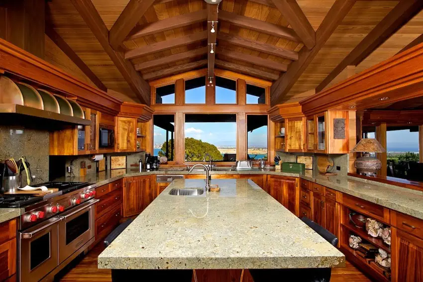 Kitchen with vaulted ceiling, island and windows