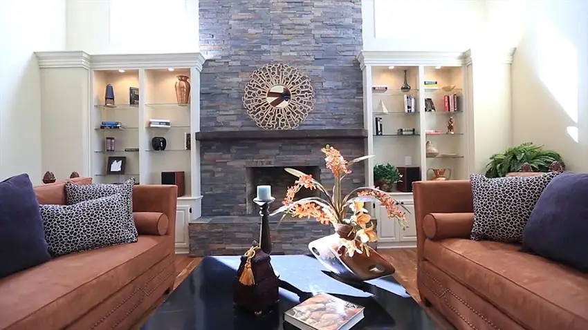 Formal living room with contemporary furniture and stacked stone fireplace