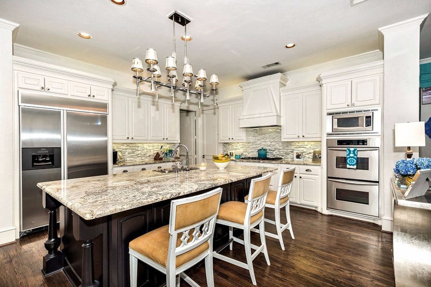 Kitchen with white cabinetry and white spring granite counters
