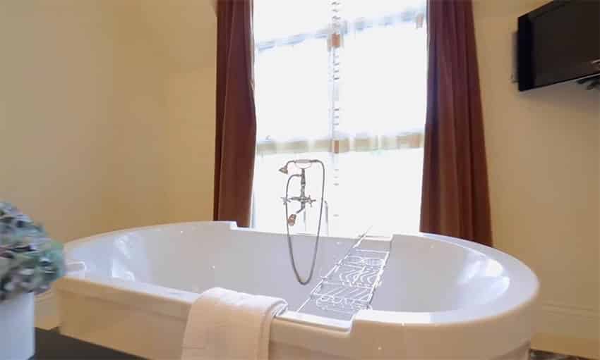 Large soaking bathtub in master suite