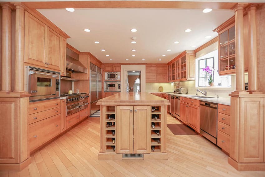 Light wood color cabinet kitchen with wood floor center island with wine storage