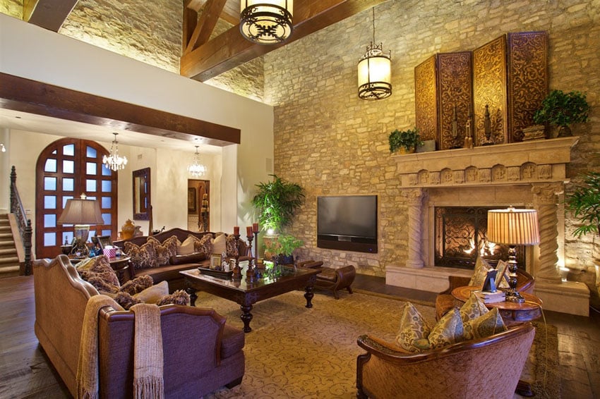 Living room with decorative fireplace and high ceiling