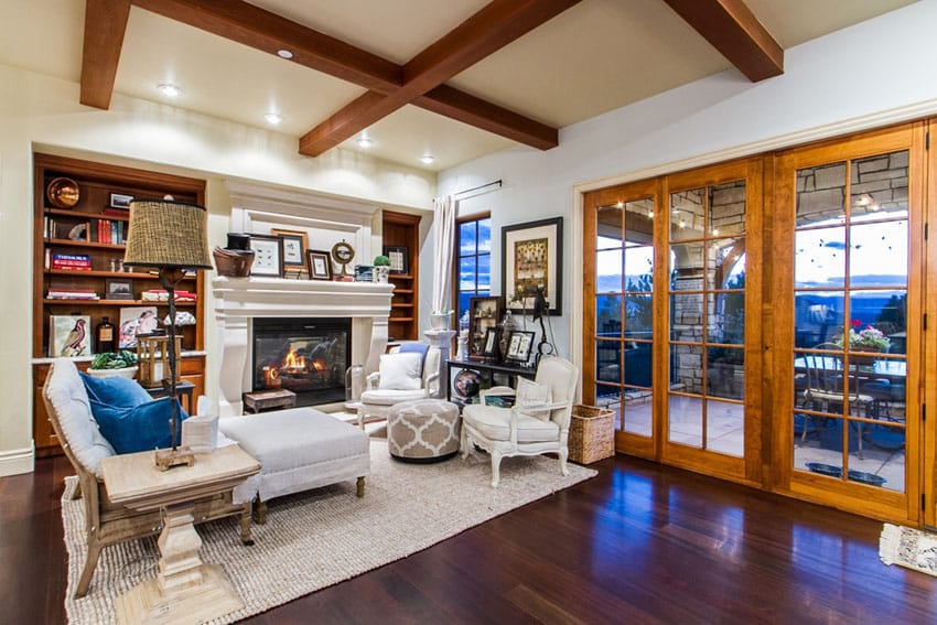 Living room with exposed beam ceiling and African mahogany hardwood flooring