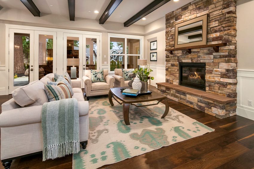 Living room with exposed beam ceiling and walnut hardwood floors