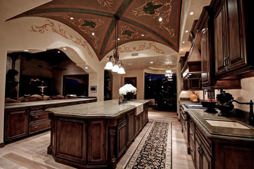 Kitchen with mural ceiling, ash colored counters and white ceiling