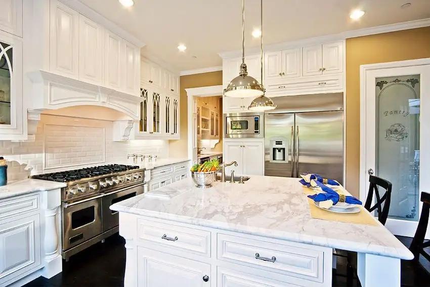 Luxury kitchen with marble countertops and white-painted cabinets