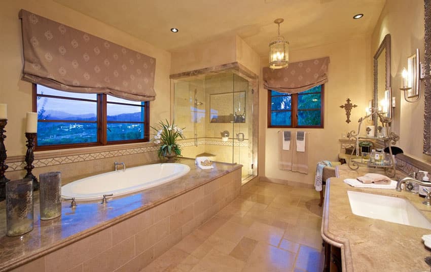 Master bathroom with enclosed tub and glass shower
